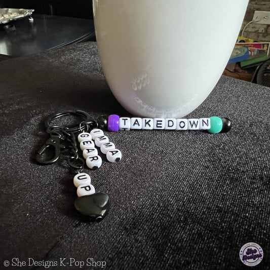 K-POP DEMON HUNTERS: HUNTRIX TAKEDOWN KEYCHAIN